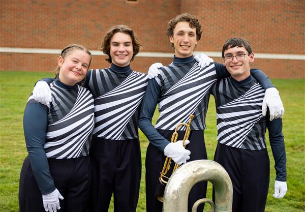 Four Summit High band members smile